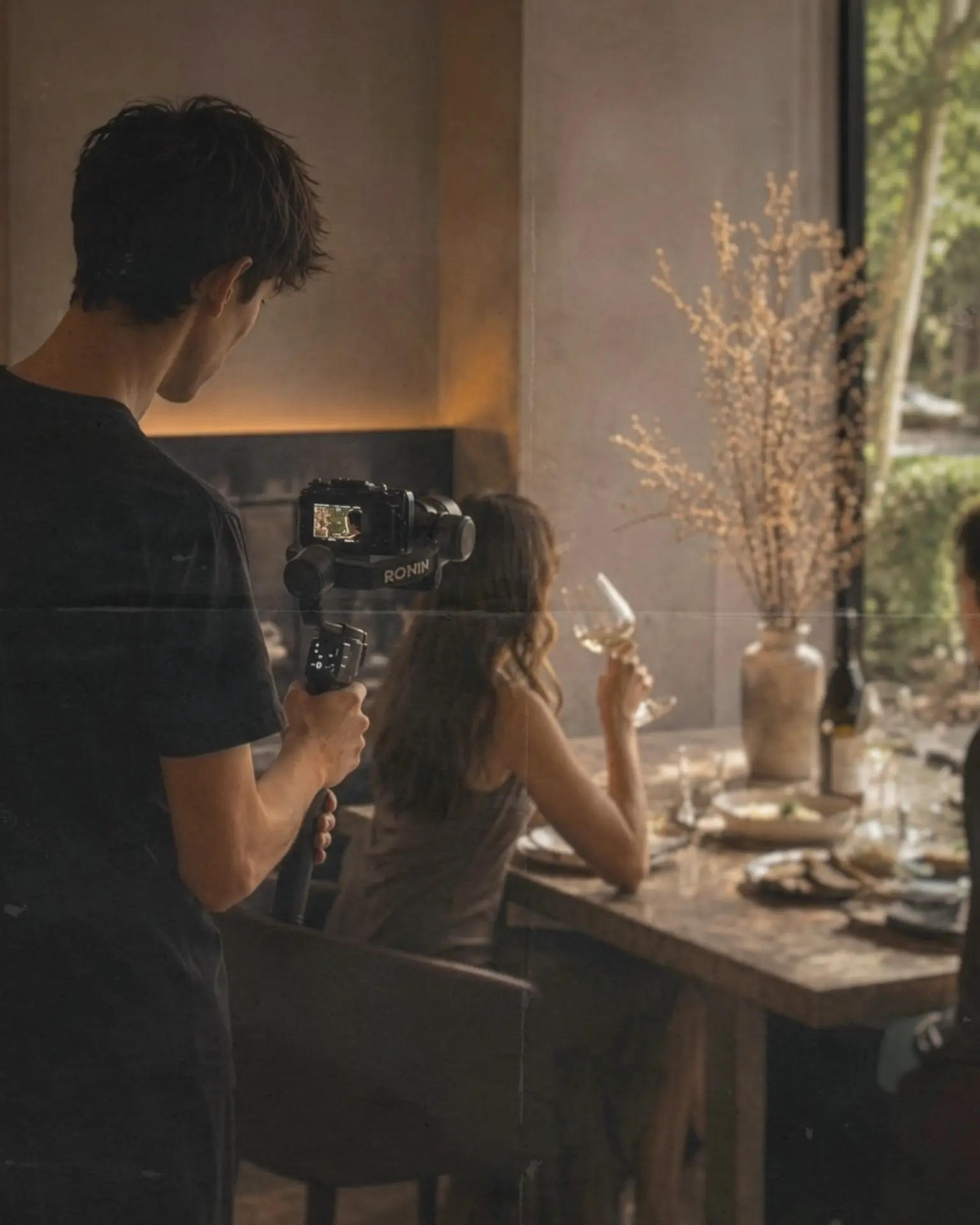 A NŌA shoot in progress — filming a table in warm afternoon light